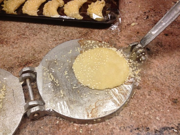 press sesame seeds into the sambusak dough