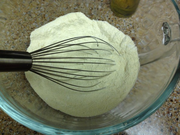 whisking together semolina and AP flours for pasta dough